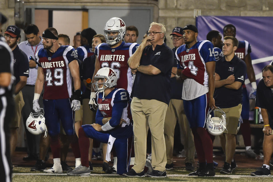 MONTREAL, QC - AUGUST 03:  Quarterback Johnny Manziel #2 (L) head coach Mike Sherman (C) and kicker Boris Bede #14 of the Montreal Alouettes (R) look on during the final seconds of the game against the Hamilton Tiger-Cats during the CFL game at Percival Molson Stadium on August 3, 2018 in Montreal, Quebec, Canada.  The Hamilton Tiger-Cats defeated the Montreal Alouettes 50-11.  (Photo by Minas Panagiotakis/Getty Images)