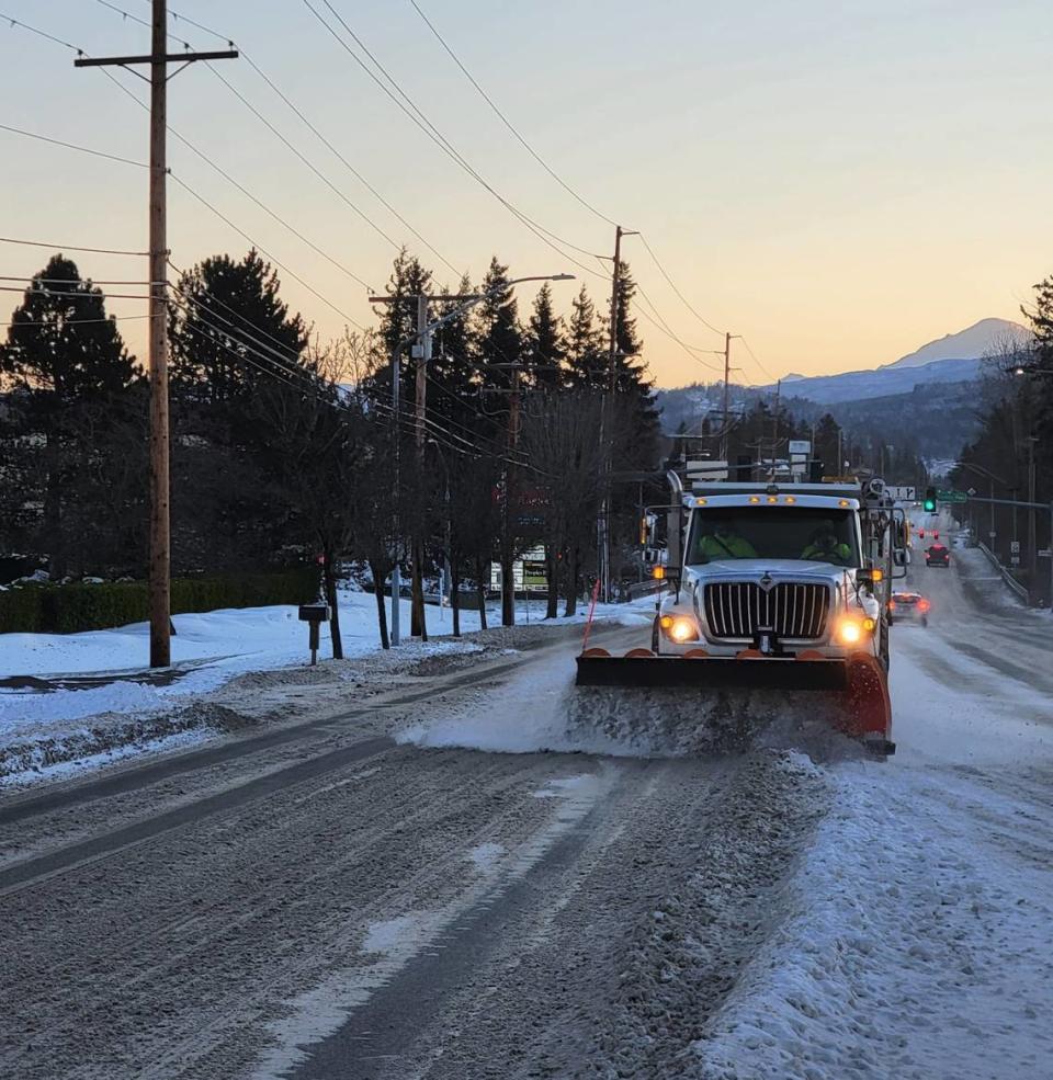 City of Bellingham crews plow snow on Bakerview Road in Bellingham, Wash., after the city got a foot of snow starting Saturday, Dec. 25, 2021.