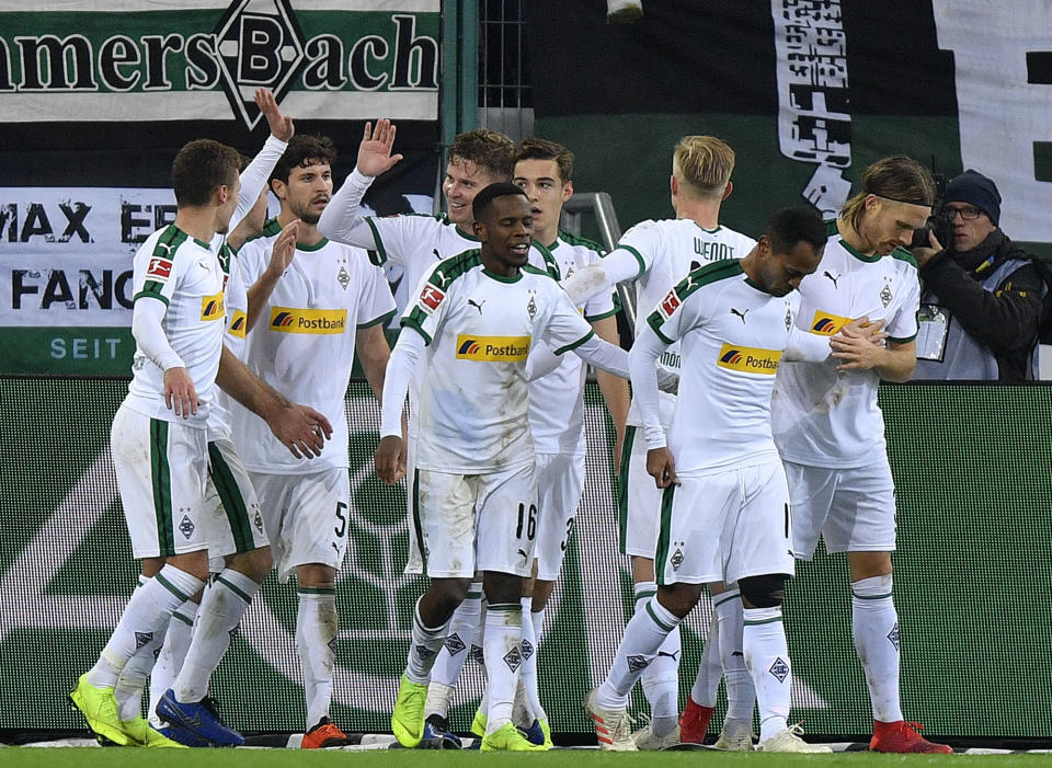 Moenchengladbach's team celebrate their side's second goal during the German Bundesliga soccer match between Borussia Moenchengladbach and VfB Stuttgart in Moenchengladbach, Germany, Sunday, Dec. 9, 2018. (AP Photo/Martin Meissner)