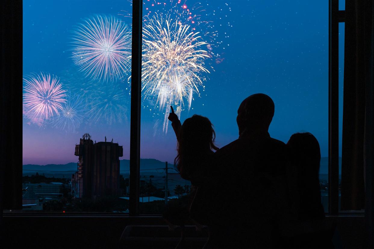 Guests at Hotel Lulu in Anaheim, Calif., view fireworks from their room.