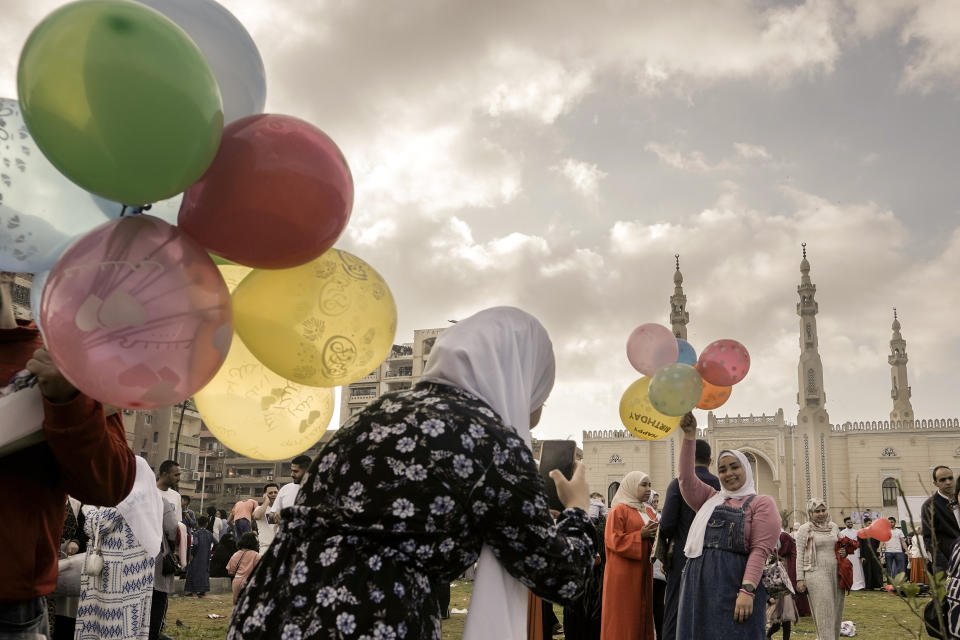 Egyptian Muslims celebrate Eid al-Fitr marking the end of the Muslim holy fasting month of Ramadan outside al-Seddik mosque in Cairo, Egypt, Friday, April 21, 2023. (AP Photo/Amr Nabil)