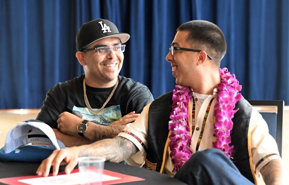 Jessi Fernandez, right, speaks to Osmin Sosa at UC Berkeley.