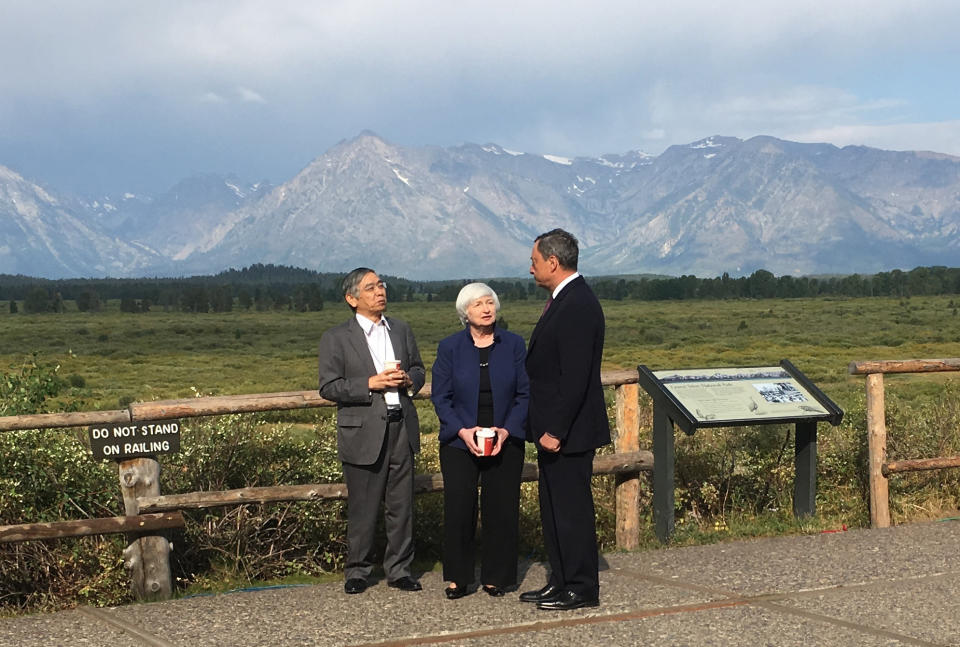 Fed Chair Janet Yellen, talks with Mario Draghi, head of the ECB, and Haruhiko Kuroda, head of the BoJ, during a break at the central bankers conference at Jackson Hole, Wyo., Friday, Aug. 25, 2017. (AP Photo/Martin Crutsinger)