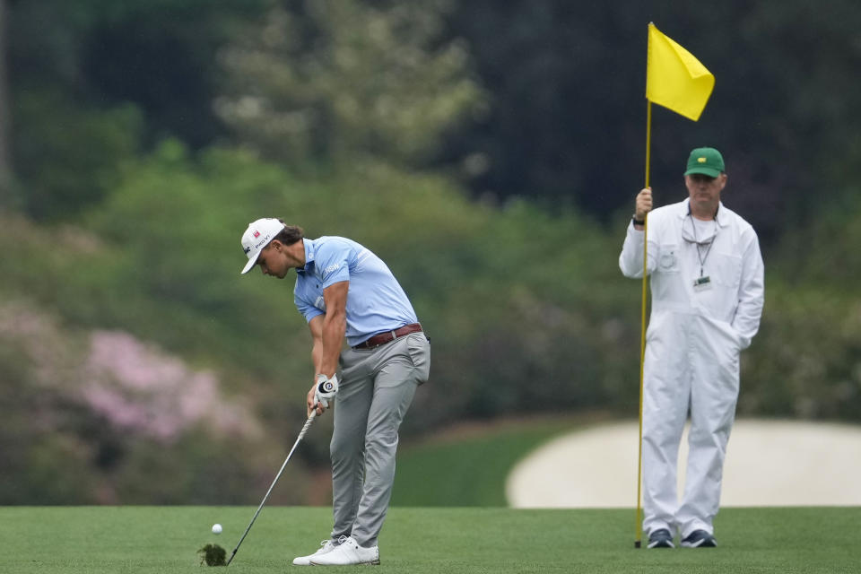 Harrison Crowe, of Australia, hits out of the 14th fairway during a practice for the Masters golf tournament at Augusta National Golf Club, Monday, April 3, 2023, in Augusta, Ga. (AP Photo/Matt Slocum)