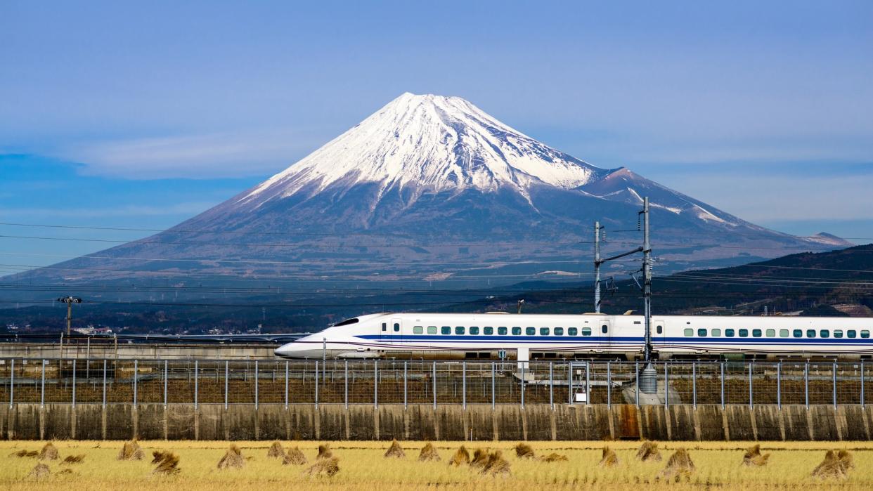 A bullet train passes below Mt. Fuji in Japan.