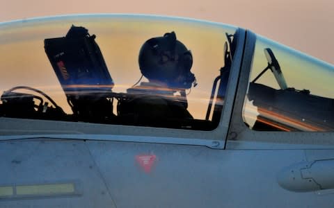 An RAF Typhoon pilot, seen here at the RAF Akrotiri air base in Cyprus. Shortening the time it takes to train fast-jet pilots has been made the RAF's priority by the Defence Secretary. - Credit: Nick Ansell/PA