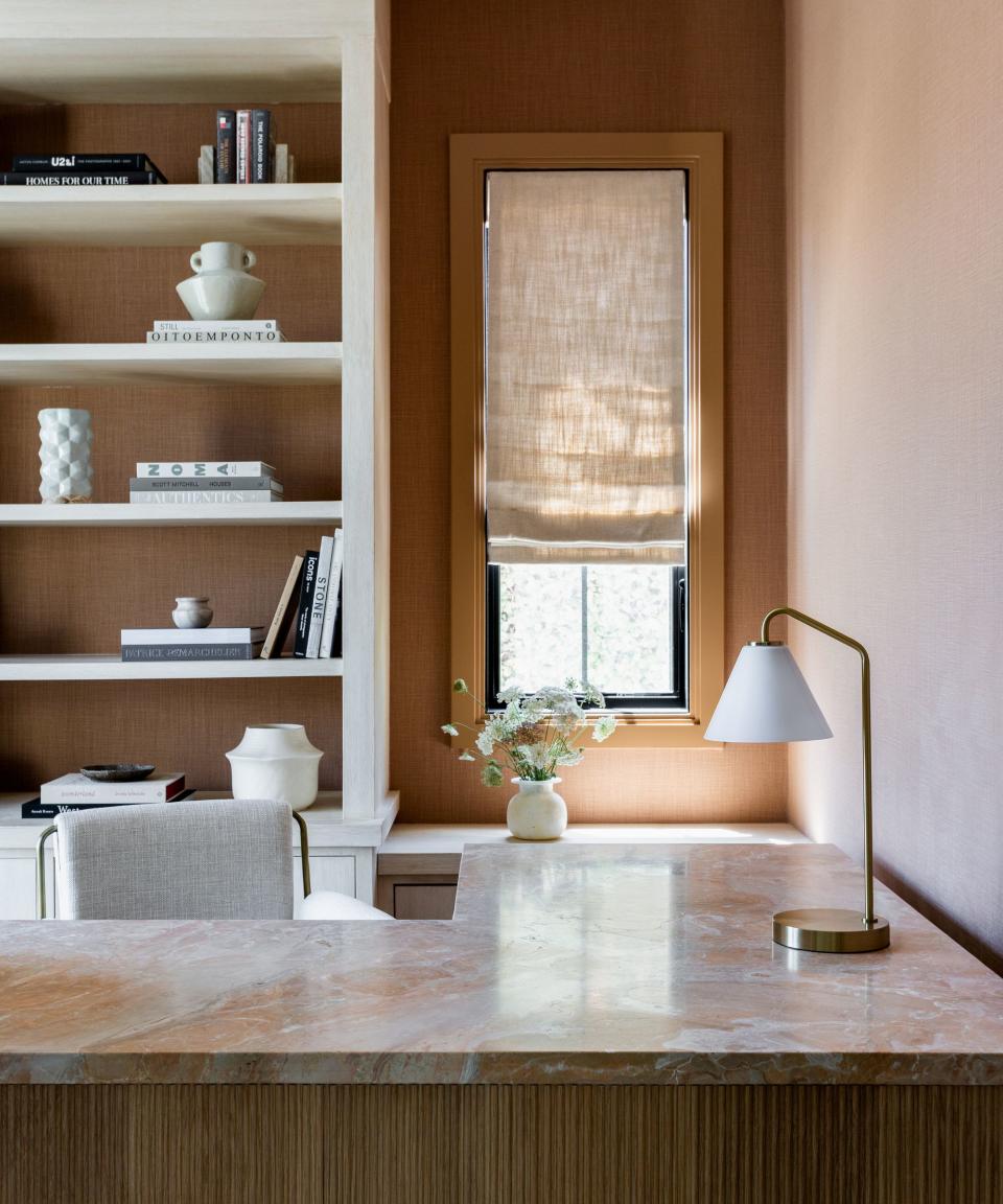 office with marble table and fitted display shelves