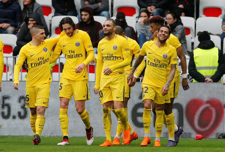 Soccer Football - Ligue 1 - OGC Nice vs Paris St Germain - Allianz Riviera, Nice, France - March 18, 2018 Paris Saint-Germain’s Dani Alves celebrates scoring their second goal with teammates REUTERS/Jean-Paul Pelissier