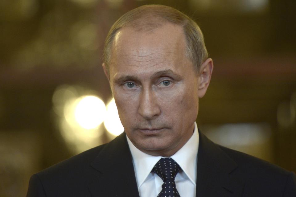 Russia's President Vladimir Putin talks to reporters during a meeting in Brasilia July 16, 2014. Putin warned on Wednesday that U.S. sanctions will take relations with Russia to a "dead end" and damage U.S. business interests in his country. Picture taken July 16, 2014. REUTERS/Alexei Nikolskyi/RIA Novosti/Kremlin (BRAZIL - Tags: POLITICS) ATTENTION EDITORS - THIS IMAGE HAS BEEN SUPPLIED BY A THIRD PARTY. IT IS DISTRIBUTED, EXACTLY AS RECEIVED BY REUTERS, AS A SERVICE TO CLIENTS