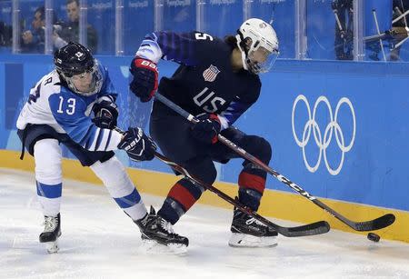 Ice Hockey - Pyeongchang 2018 Winter Olympics - Women's Semifinal Match - U.S. v Finland - Gangneung Hockey Centre, Gangneung, South Korea - February 19, 2018 - Riikka Valila of Finland (L) and Megan Keller of U.S. in action. REUTERS/David W Cerny