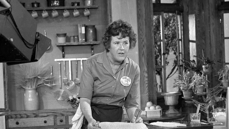 Television cooking personality Julia Child prepares a French delicacy in her cooking studio on Nov. 24, 1970.