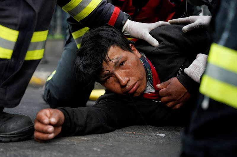 Indigenous protesters march through Quito demanding concessions from President Lasso