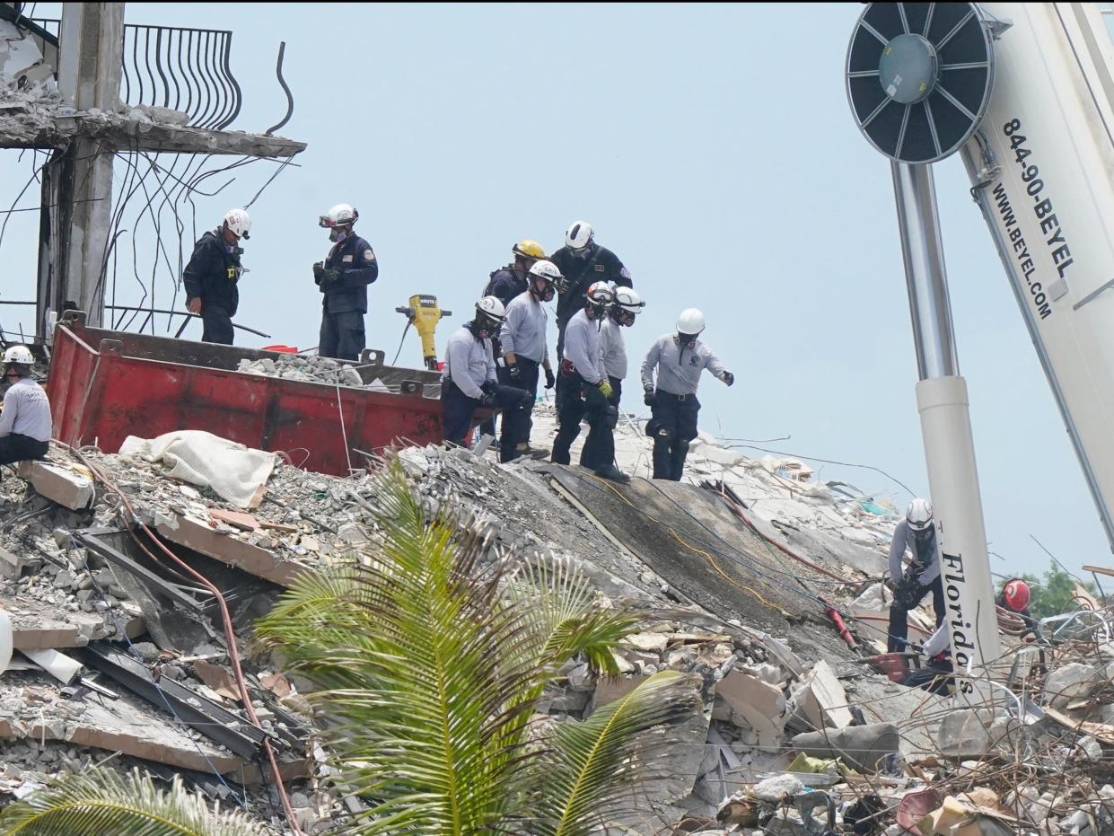 Rescue workers continue to search the rubble of Champlain Towers South (AP)