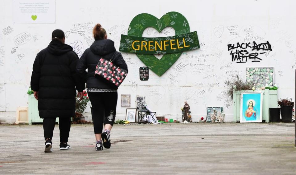 Two women are seen approaching a tribute to the Grenfell Tower fire. File image. (Jonathan Brady/PA) (PA Archive)