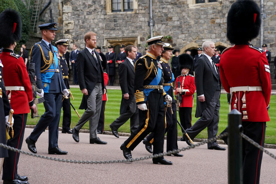 (left to right) The Prince of Wales, the Duke of Sussex, Peter Phillips, King Charles III, the Princess Royal and the Duke of York follow the State Hearse carrying the coffin of Queen Elizabeth II, draped in the Royal Standard with the Imperial State Crown and the Sovereign's Orb and Sceptre, as it arrives at the Committal Service held at St George's Chapel in Windsor Castle, Berkshire. Picture date: Monday September 19, 2022. Kirsty O'Connor/Pool via REUTERS