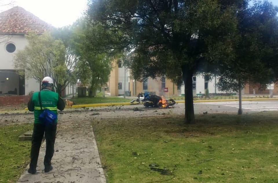 In this image provided by military personnel, flames rise from a deadly car bombing at a police academy on Thursday, Jan. 17, 2019, in Bogota, Colombia. (AP Photo)