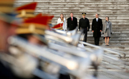 A military band passes stand-ins for President-elect Donald Trump, and his wife Melania (L) and Vice President-elect Mike Pence and his wife Karen (R) during a rehearsal for the inauguration on the East Front of the U.S. Capitol in Washington. From L-R are SGM Gregory Lowery, SPC Sara Corry, Maj. Gen. Bradley Becker, MSG Neil Ewachiw and MSG Leigh Ann Hinton. REUTERS/Kevin Lamarque