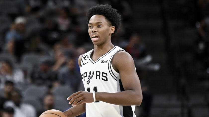 Spurs guard Josh Primo brings the ball up court during a 2022 preseason game against the Thunder