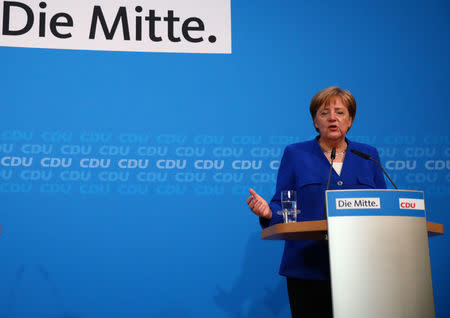 German Chancellor Angela Merkel gives a statement after a meeting with Christian Social Union (CSU) Interior Minister Horst Seehofer at the CDU headquarters in Berlin, Germany, July 2, 2018. REUTERS/Hannibal Hanschke