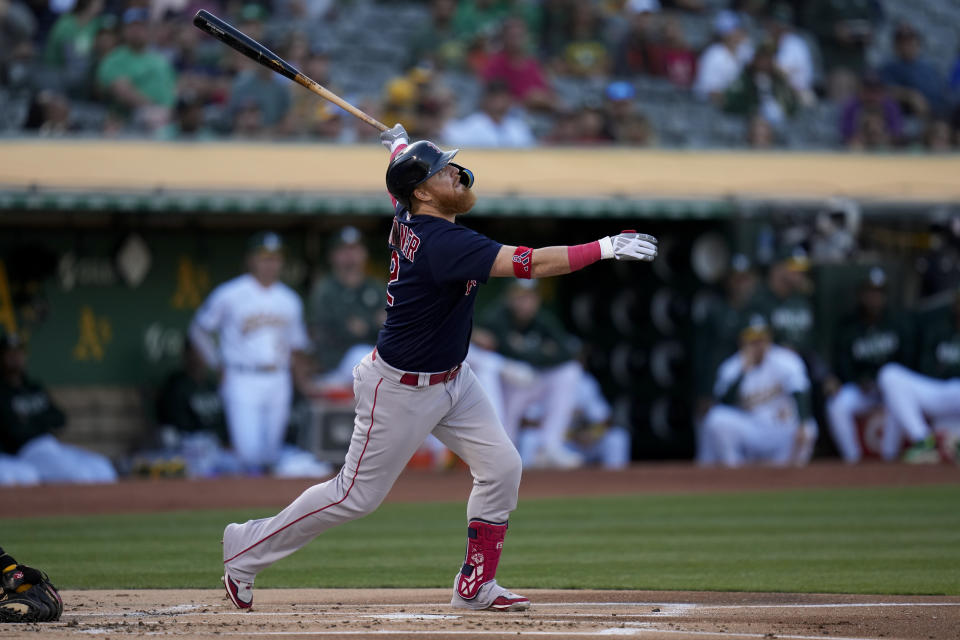 Boston Red Sox's Justin Turner watches his sacrifice fly against the Oakland Athletics during the first inning of a baseball game Monday, July 17, 2023, in Oakland, Calif. (AP Photo/Godofredo A. Vásquez)