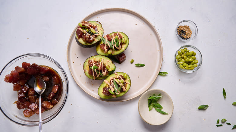 A plate of poke-stuffed avocados and marinated raw tuna cubes