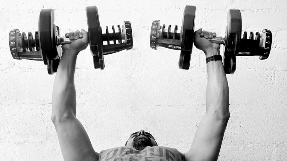 Trainer Jonathan Goodman lifting weights