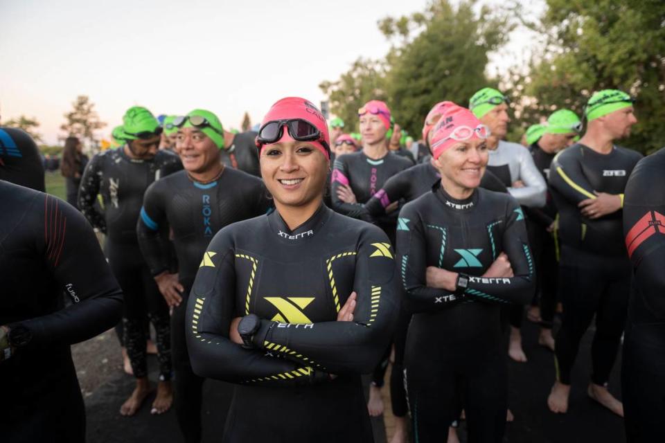 Kim Urmaza of Salt Lake City waits to start the Ironman California triathlon on Sunday, Oct. 23, 2022, in Sacramento.