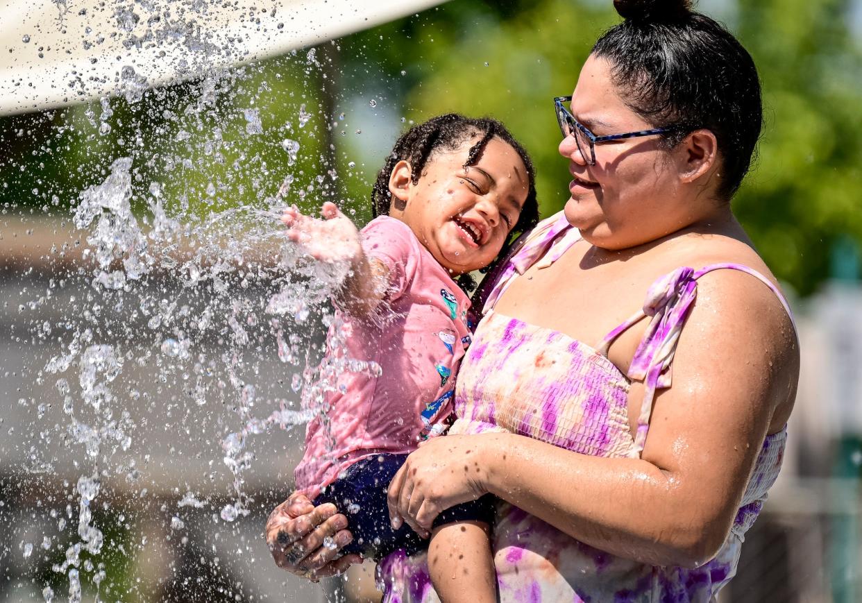 Antonia Robles of Exeter plays with her daughter Lennox Taylor, 1, Tuesday, September 6, 2022 in the splash pad at Riverway Sports Park in Visalia.