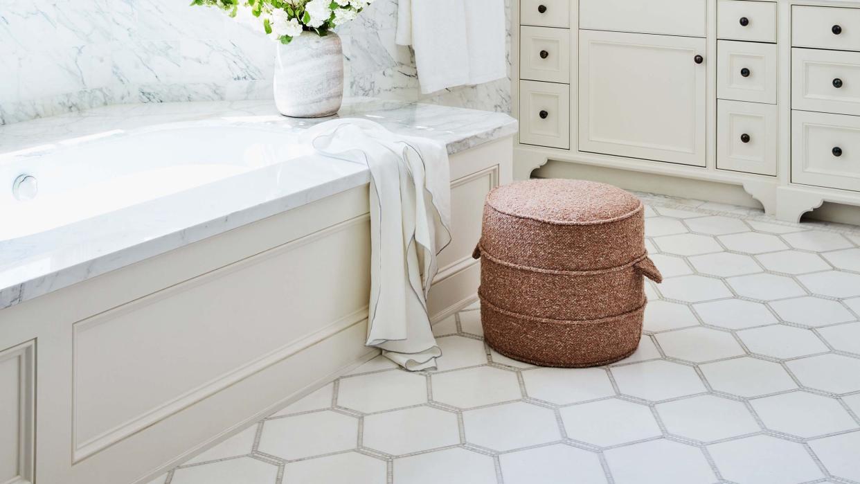 a bathroom with a tub and sink