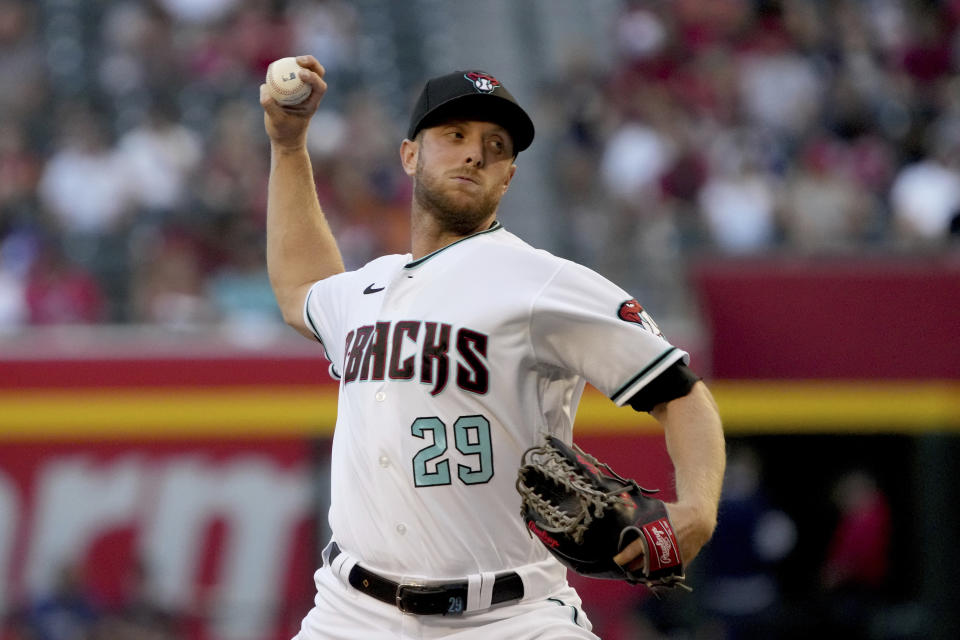 Arizona Diamondbacks pitcher Merrill Kelly throws against the Los Angeles Angels in the first inning during a baseball game, Friday, June 11, 2021, in Phoenix. (AP Photo/Rick Scuteri)