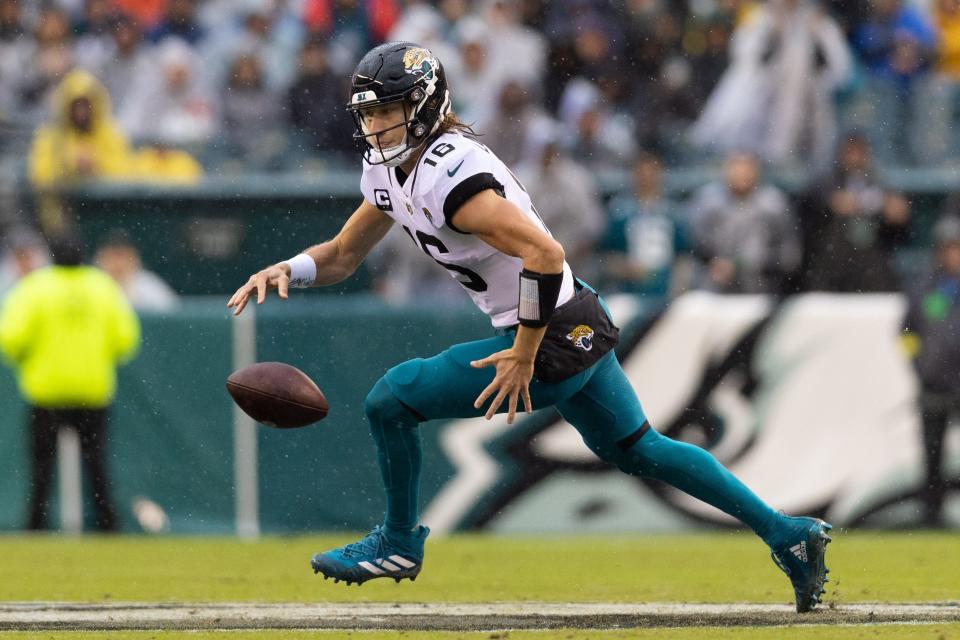 Oct 2, 2022; Philadelphia, Pennsylvania, USA; Jacksonville Jaguars quarterback Trevor Lawrence (16) fumbles the ball while running out of the pocket against the Philadelphia Eagles during the second quarter at Lincoln Financial Field. Mandatory Credit: Bill Streicher-USA TODAY Sports