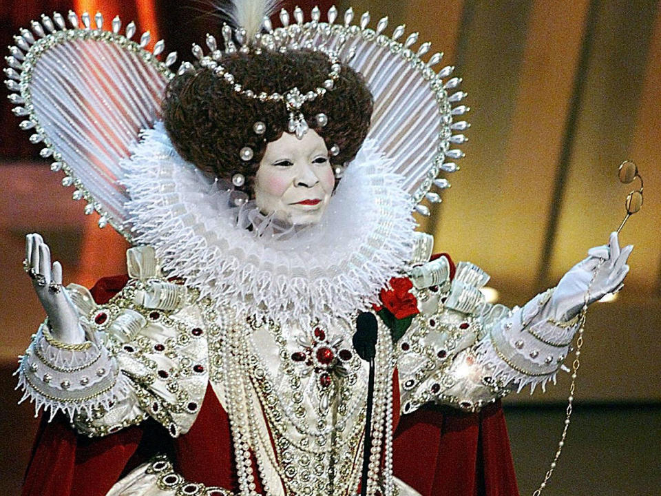 Whoopi Goldberg, dressed as Britain's Queen Elizabeth I, who was portrayed in 