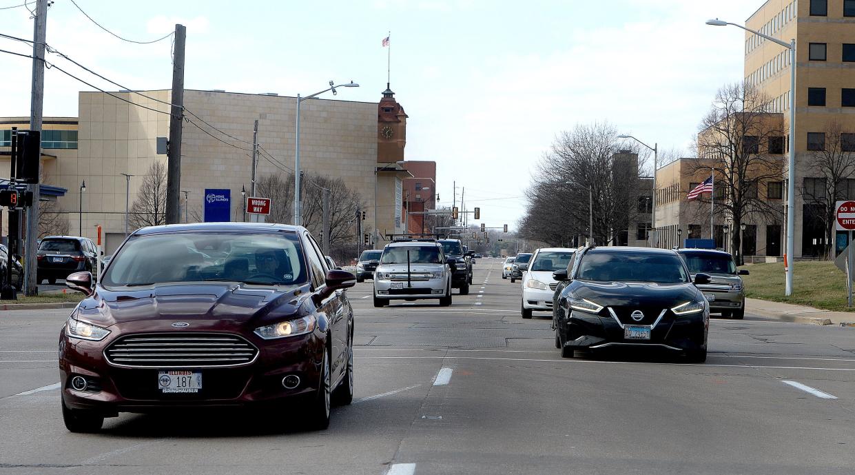 Vehicles travel down Madison Street between 9th and 11th Streets Tuesday, March 7, 2023. 