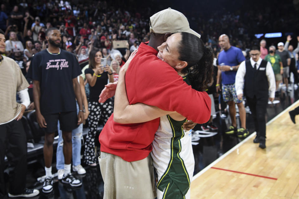 Seattle Storm guard Sue Bird gets a hug from Phoenix Suns guard Chris Paul after a WNBA basketball game against the Las Vegas Aces, Sunday, Aug. 14, 2022, in Las Vegas. It was Bird's final regular season WNBA game. (AP Photo/Sam Morris)