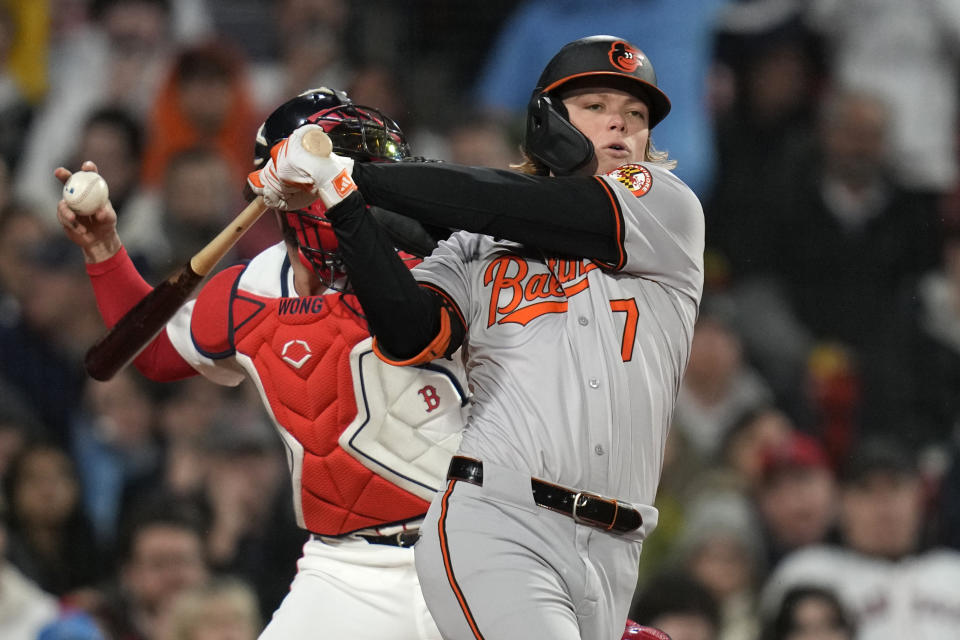 Baltimore Orioles' Jackson Holliday strikes out during the third inning of a baseball game against the Boston Red Sox, Wednesday, April 10, 2024, in Boston. (AP Photo/Charles Krupa)