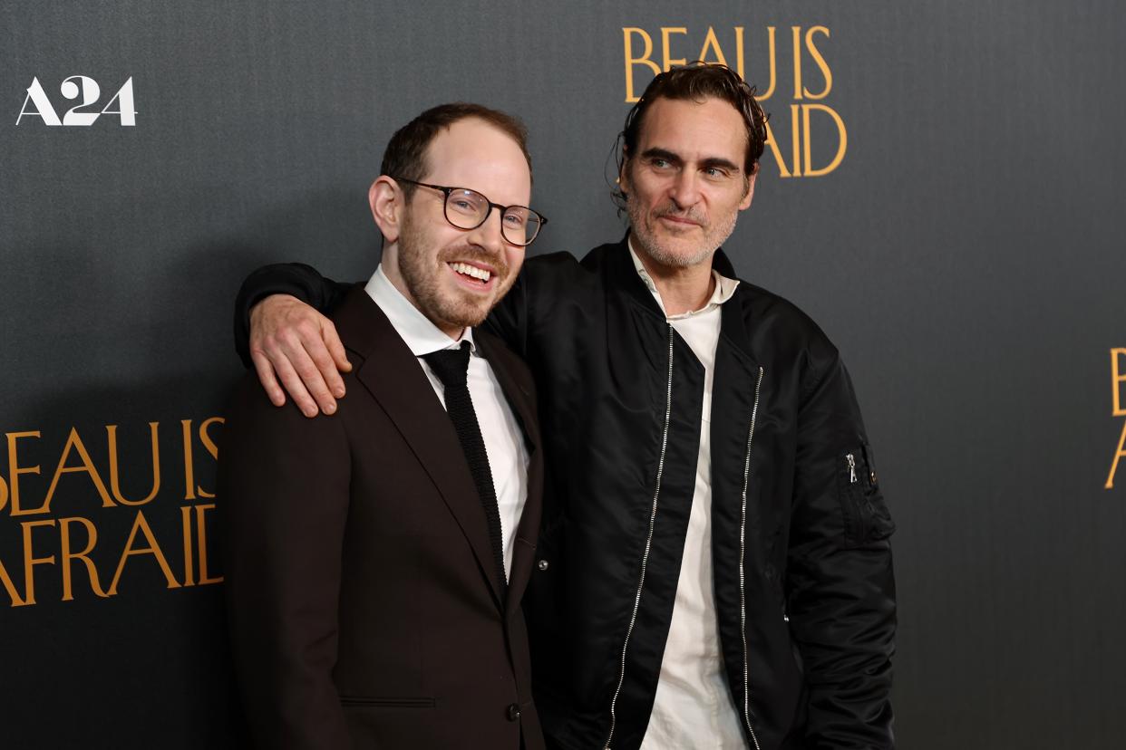 LOS ANGELES, CALIFORNIA - APRIL 10: (L-R) Ari Aster and Joaquin Phoenix attend the Los Angeles premiere of A24's 