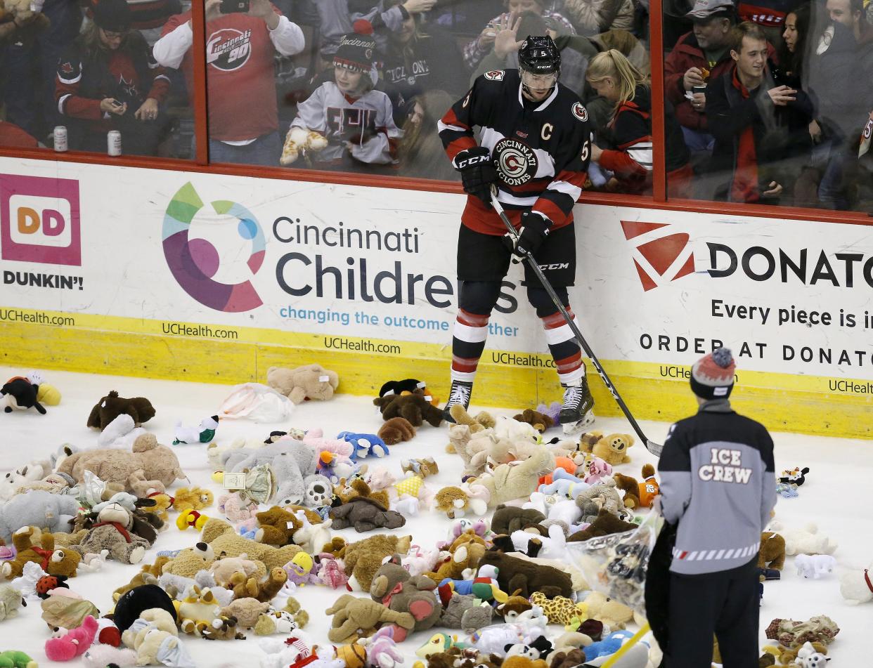 Fans threw approximately 4,000 stuffed animals onto the Cincinnati Cyclones' rink at the team's annual Teddy Bear Toss event on Jan. 6, 2018. This Saturday's event will donate the toys to Matthew 25 Ministries, as well as Cincinnati police and fire departments.
