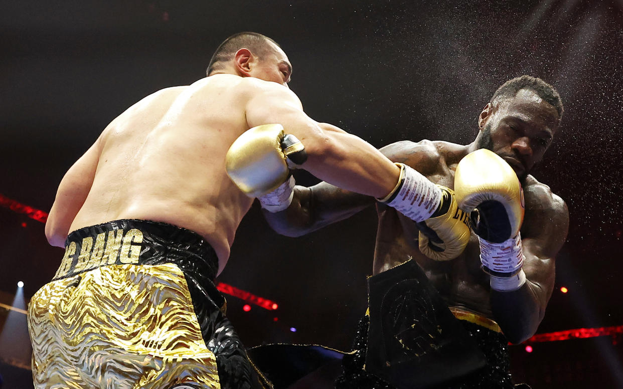 RIYADH, SAUDI ARABIA - JUNE 01: Deontay Wilder of Team Matchroom is knocked down by Zhilei Zhang of Team Queensberry during the Heavyweight fight between Deontay Wilder of Team Matchroom and Zhilei Zhang of Team Queensberry on the 5v5: Queensberry v Matchroom Fight Night card at Kingdom Arena on June 01, 2024 in Riyadh, Saudi Arabia. (Photo by Richard Pelham/Getty Images)