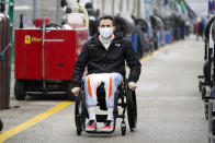 Robert Wickens makes his way to his pit stall during practice for the Rolex 24 hour auto race at Daytona International Speedway, Thursday, Jan. 27, 2022, in Daytona Beach, Fla. (AP Photo/John Raoux)