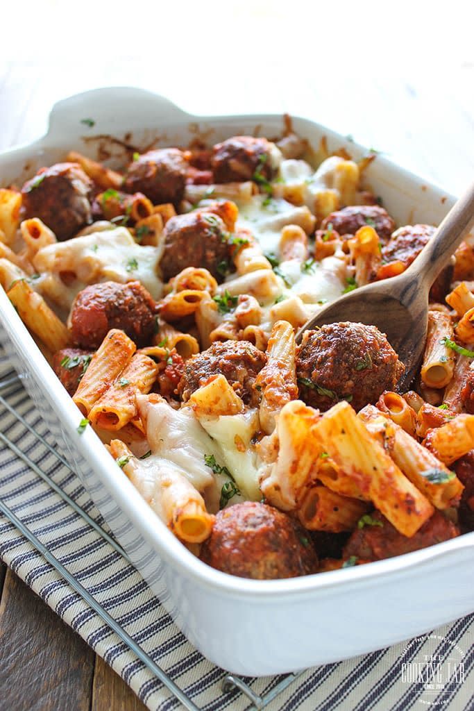 meatball pasta bake with wooden spoon