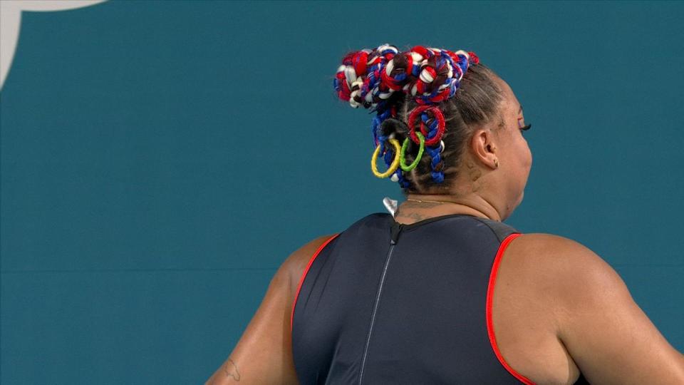 Emily Campbell red blue and white hair with the Olympic rings