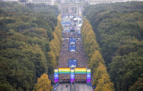 Runners of the first wave line up on the street of June 17 for the start of the Berlin Marathon, in Berlin, Sunday, Sept. 25, 2022. (Andreas Gora/dpa via AP)
