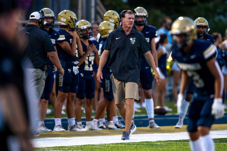 Kingfisher Coach Jeff Myers walks on the sidelines during a home game between Kingfisher High School and Clinton High School Friday.