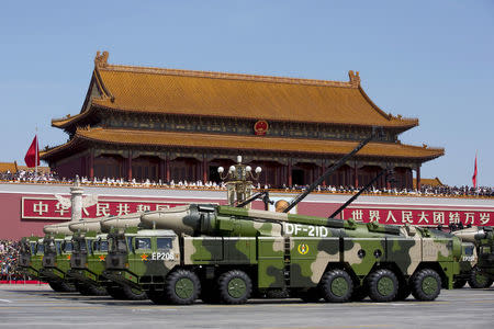 FILE PHOTO: Chinese military vehicles carrying DF-21D anti-ship ballistic missiles, potentially capable of sinking a U.S. Nimitz-class aircraft carrier in a single strike, travel past Tiananmen Gate during a military parade to commemorate the 70th anniversary of the end of World War II in Beijing Thursday Sept. 3, 2015. REUTERS/Andy Wong/Pool/File Photo/