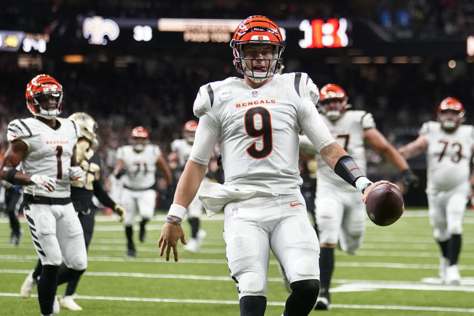 Cincinnati Bengals quarterback Joe Burrow (9) runs for a touchdown against the New Orleans Saints during the first half of an NFL football game in New Orleans, Sunday, Oct. 16, 2022. (AP Photo/Gerald Herbert)