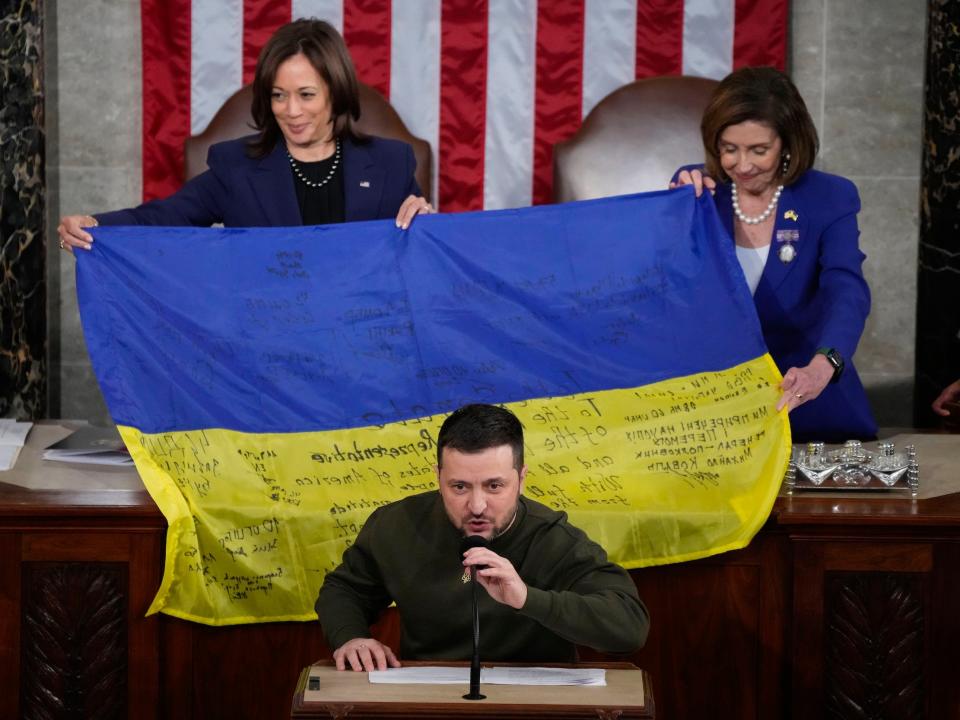 Ukrainian President Zelenskyy presents battle flag to Vice President Kamala Harris and House Speaker Nancy Pelosi.