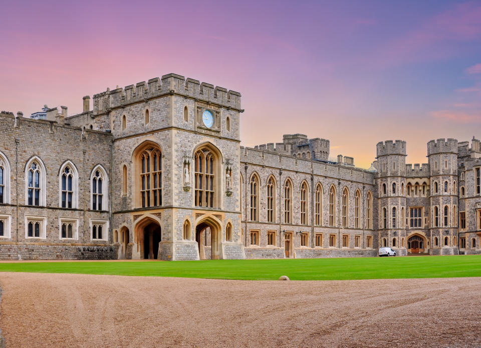 Windsor, UK - April 2018: Walls and architecture of Windsor castle at sunset