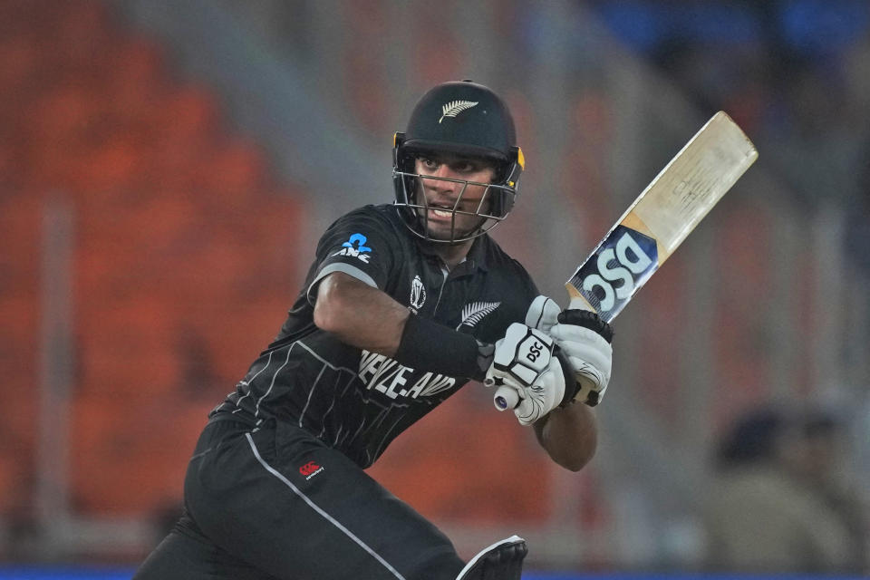 New Zealand's Rachin Ravindra plays a shot during the ICC Cricket World Cup opening match between England and New Zealand in Ahmedabad, India, Thursday, Oct. 5, 2023. (AP Photo/Ajit Solanki)