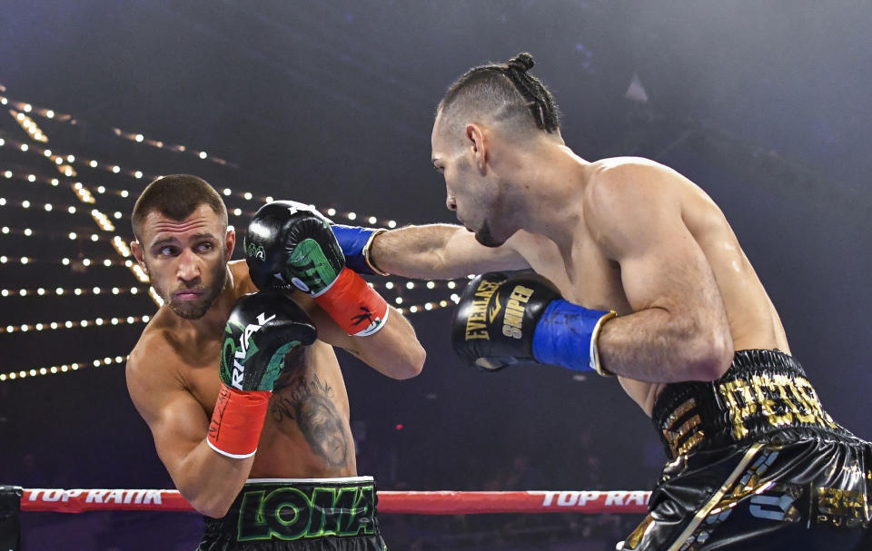 Vasiliy Lomachenko moves away from punch from Jose Pedraza in the WBO lightweight title boxing match at Madison Square Garden, Saturday, Dec. 8, 2018, in New York. (AP Photo/Howard Simmons)