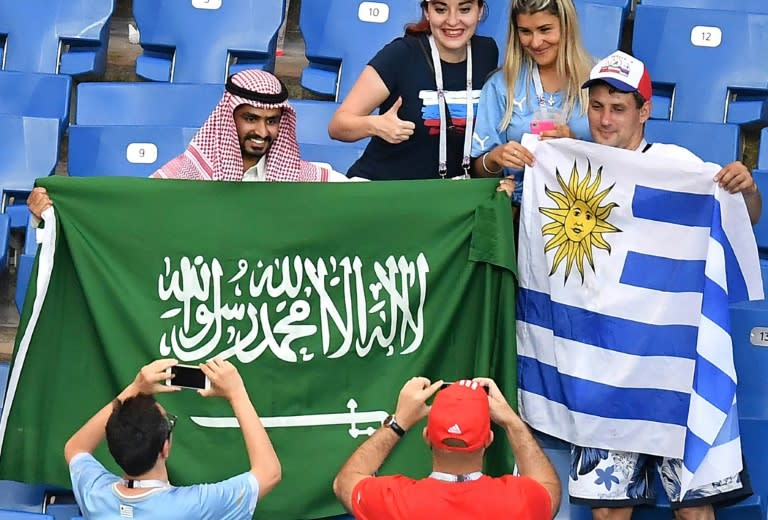 Uruguay and Saudi Arabia supporters get to know each other before their teams' Group A clash